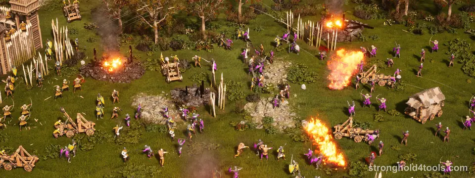 A battle on open grass in Stronghold 4: yellow and purple armies fight among wooden stakes, a burning fire and a catapult
